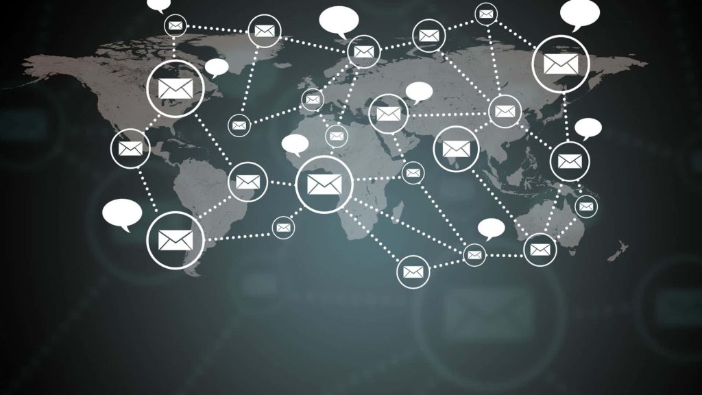 Black and white world map with envelope and speech bubble icons showing global communication network Wallpaper