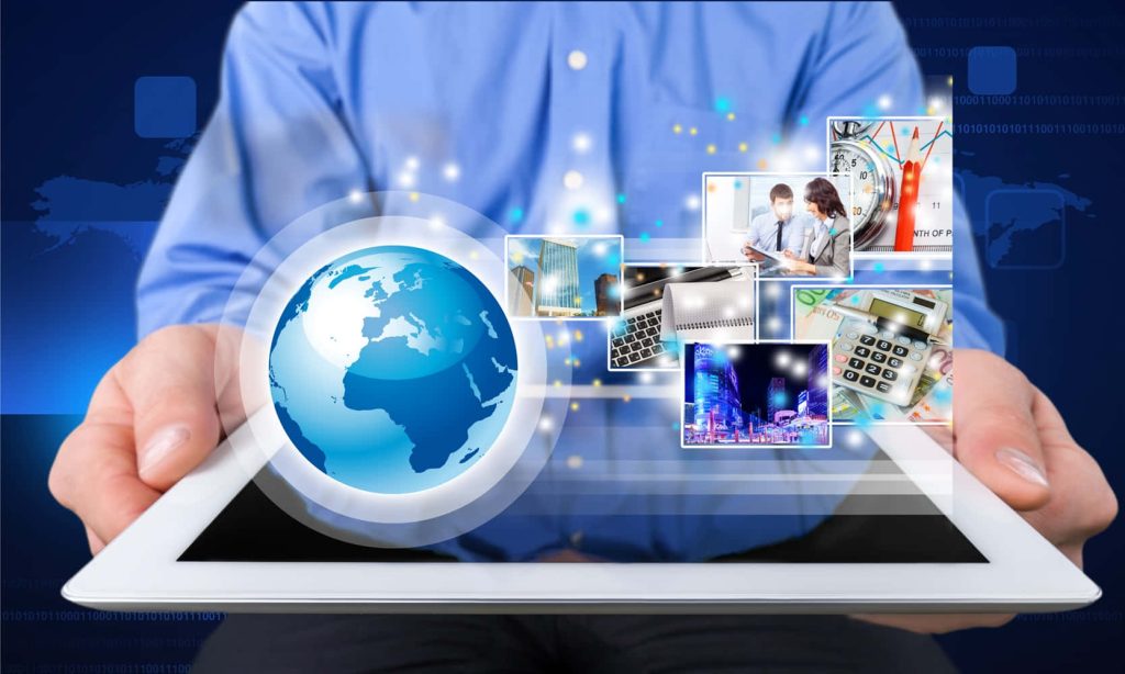 Business professional using tablet with glowing 3D globe and floating data tools holographic UI background Wallpaper