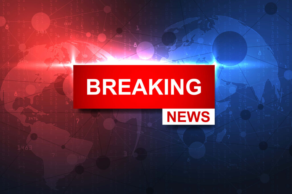 Breaking News graphic with bold white text over digital world map and network data background Wallpaper