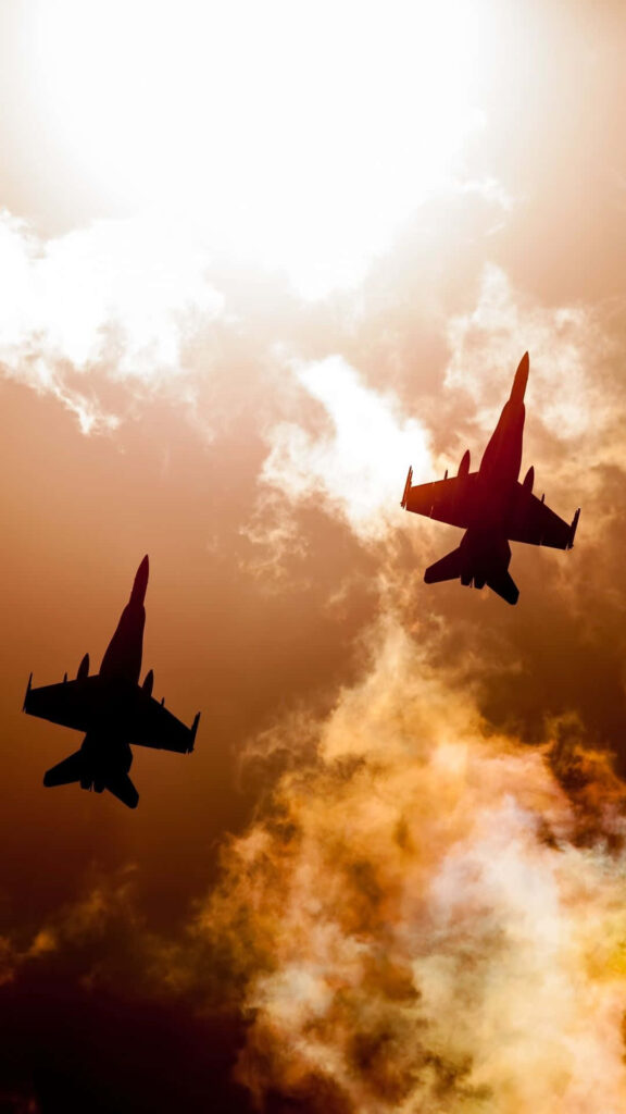 Awe-inspiring Android Skies: Majestic F-16 Fighting Falcons in a Radiant Yellow Sky Wallpaper
