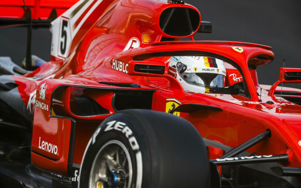 Unveiling the Exquisite Glories of the Ferrari F1 2018: A Captivating Close-up in its Background Wallpaper