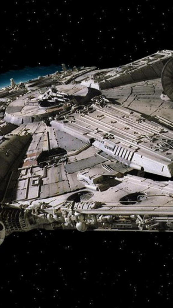 Journey through the Galaxies: The Iconic Millennium Falcon amidst a Stellar Expanse Wallpaper