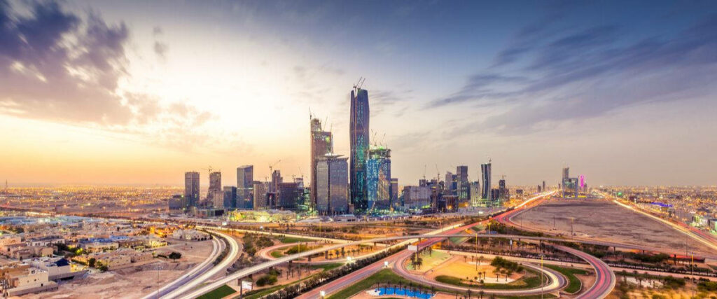 A Captivating Vista of Riyadh's Mesmerizing Cityscape Painted by a Breathtaking Sunset Wallpaper