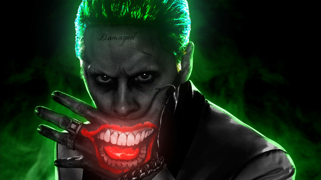 The Malevolent Joker: A Vibrant HD Artwork Unveils the Villain with a Luminous Mouth Illuminating His Hand Wallpaper