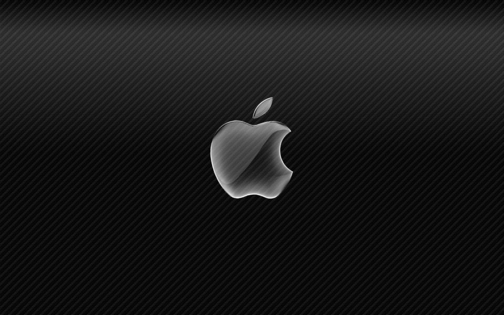 Glossy Apple logo on sleek dark carbon fiber texture wallpaper modern high tech background