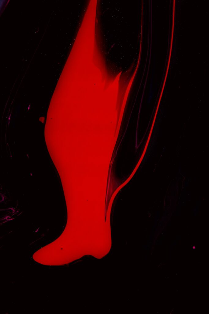 Bold Black and Red Abstract Wallpaper: Liquid Paint Flow Design