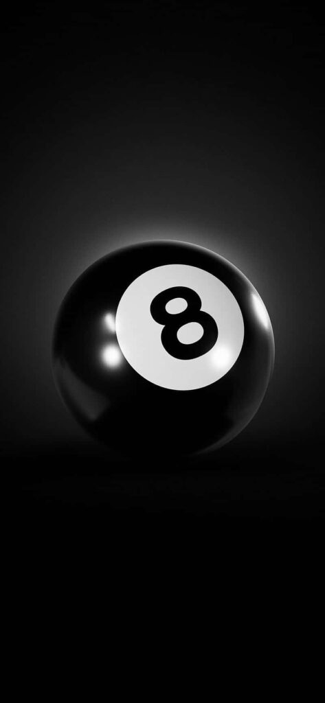 Glossy eight-ball on dark background minimalist billiards wallpaper with dramatic black and white tones