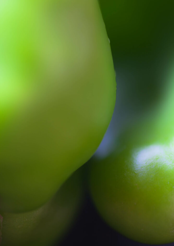 Glossy Green Peppers Close-Up: Textured Wallpaper Background