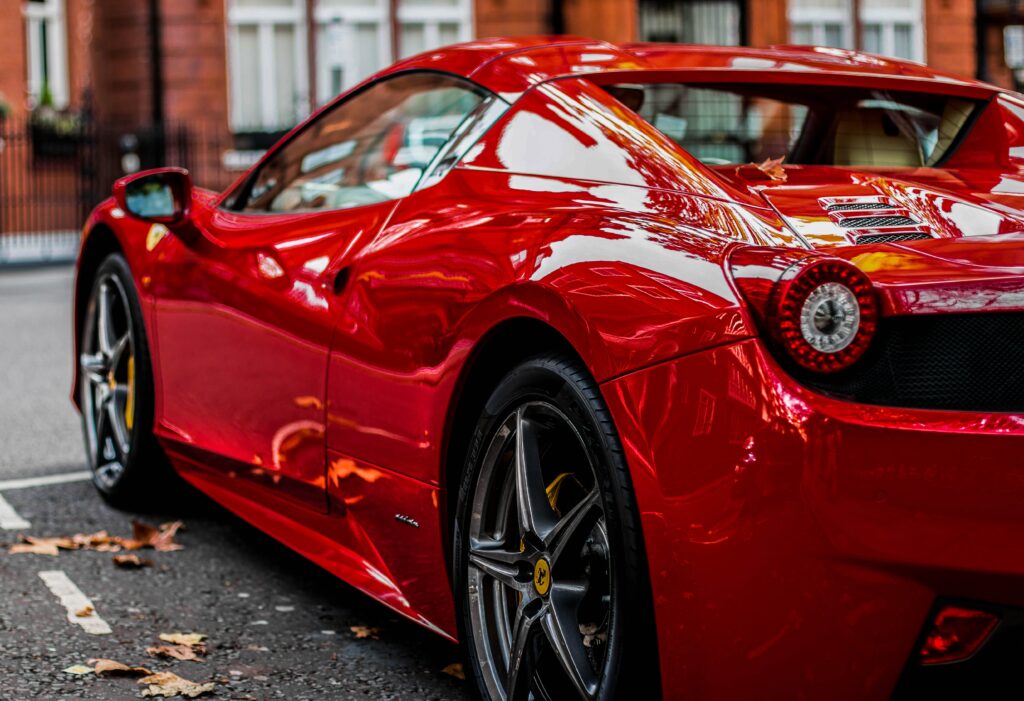 Red Sports Car Rear View Wallpaper: Sleek & Aerodynamic Design