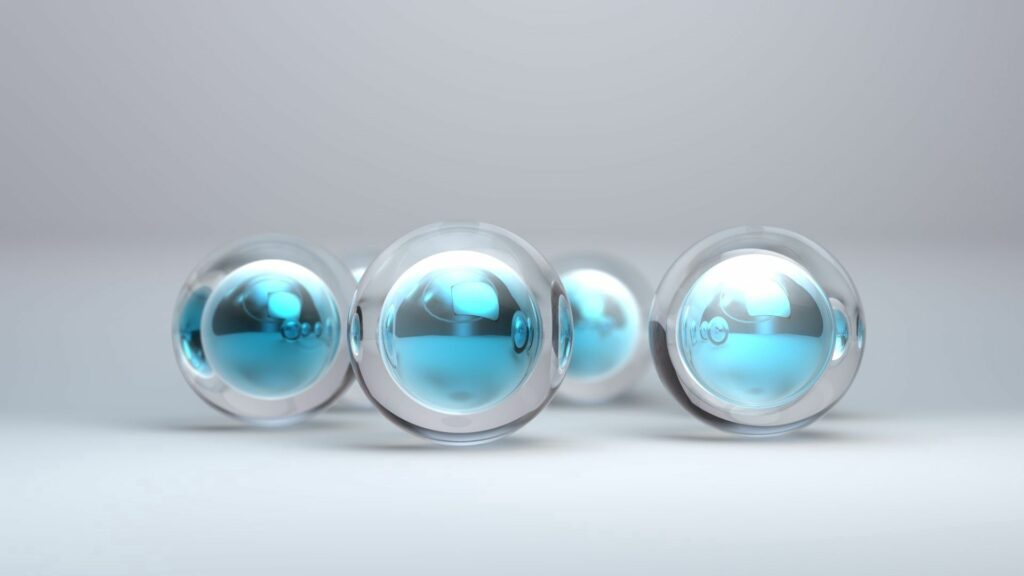 Glossy Spheres Background: Vibrant Blue Cores & Transparent Layers Wallpaper
