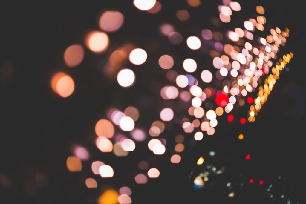 Radiant Abstract Wallpaper: Glowing Circles on Dark Background