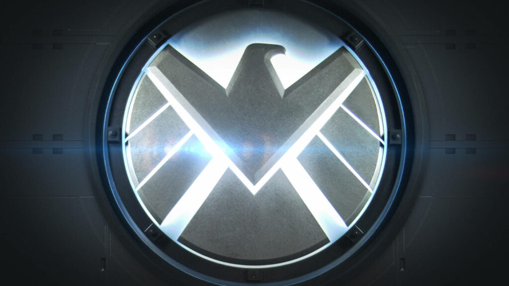 Agents of S H I E L D glowing metallic symbol on dark high tech wallpaper background