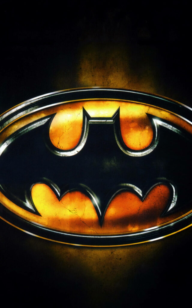 Glowing Batman logo on luminous golden background striking iconic superhero wallpaper design