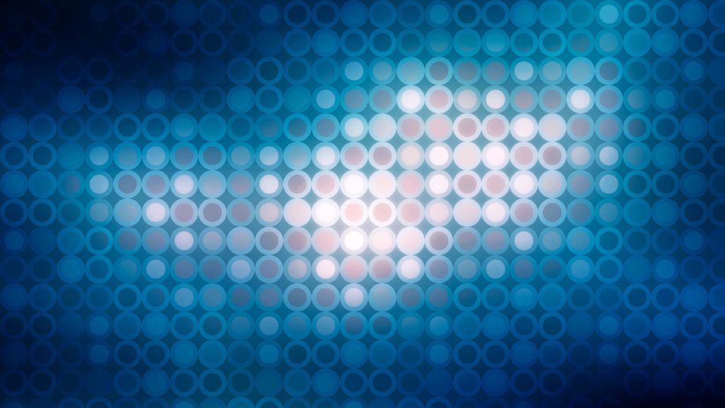 Abstract digital wallpaper with glowing blue circles in a radiant grid for modern PC background