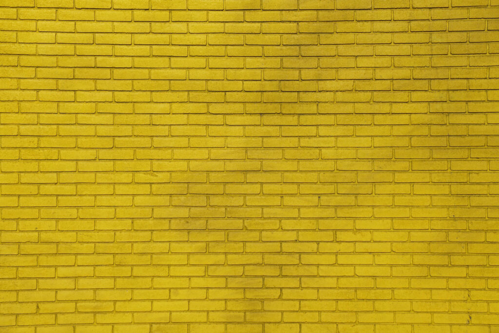 Glowing Illumination: Exquisite Neon Yellow Background of Bricks Wallpaper