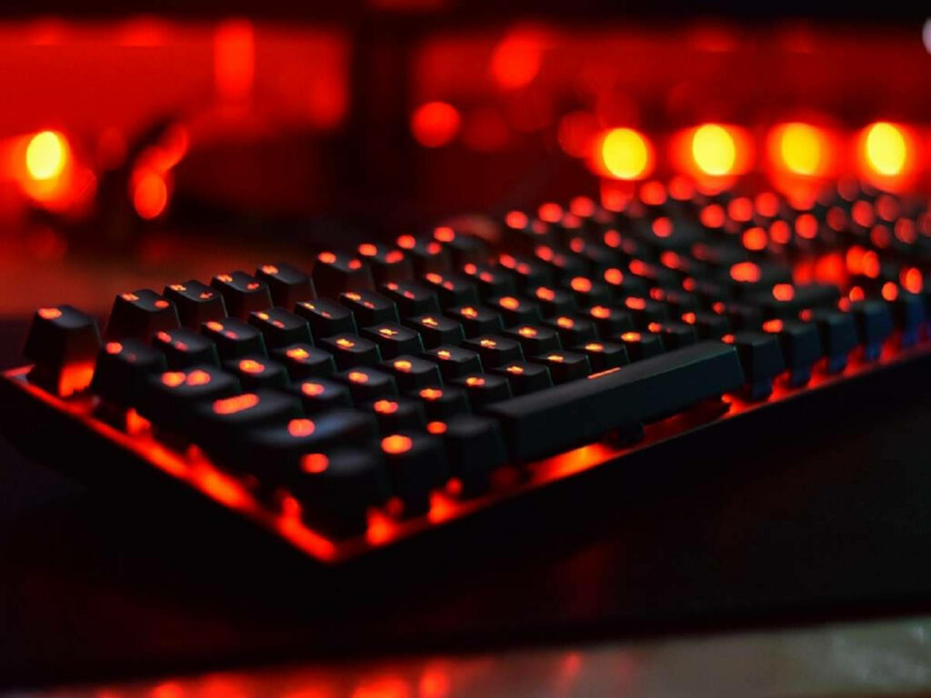 Immersive Computing: Mesmerizing Mechanical Keyboard Illuminates Desk Setup Wallpaper