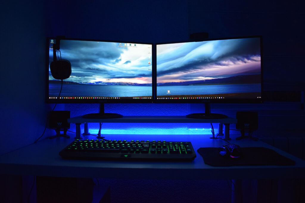Glowing Elevated Double Screens of a Contemporary Desktop Computer Wallpaper