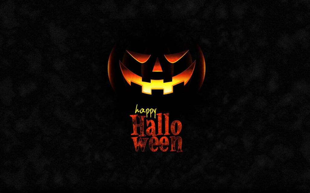 Glowing Pumpkin Celebration: Spooky Halloween Computer Atmosphere Wallpaper