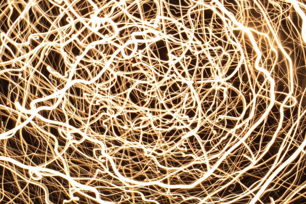 Captivating Glowing Light Trails Wallpaper: Energy & Movement