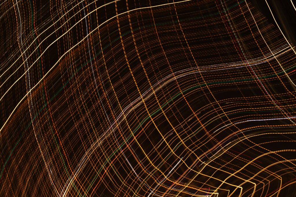 Mesmerizing Glowing Lines Wallpaper: Abstract Light Trails Background
