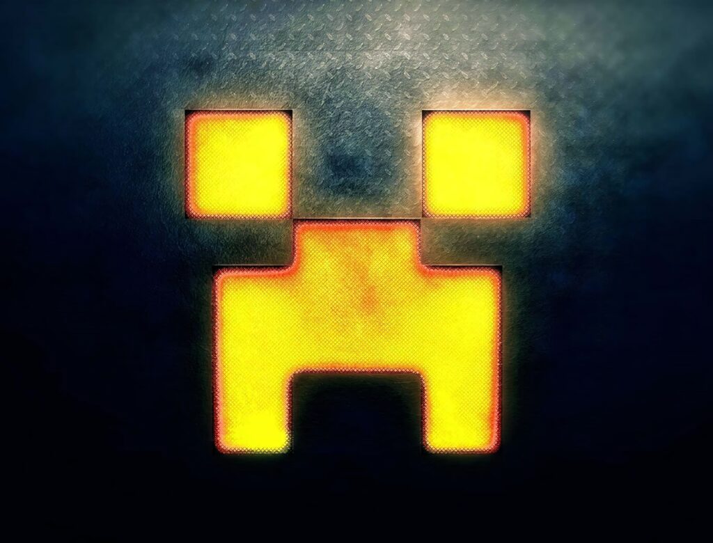 Minecraft Creeper face wallpaper glowing yellow orange pixelated design on dark textured background