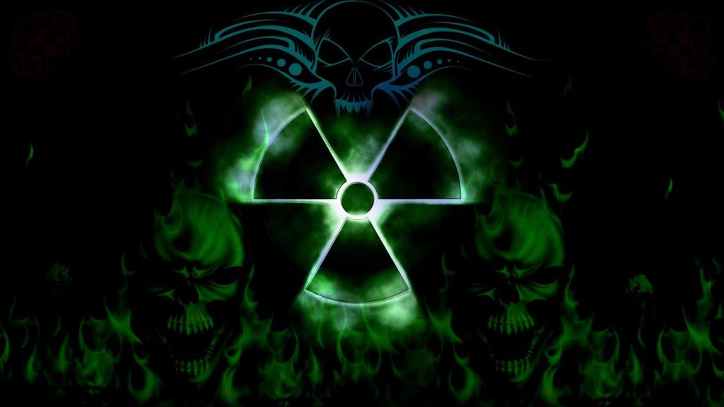 Neon wallpaper with glowing green radioactive symbol and tribal flaming skulls on dark background