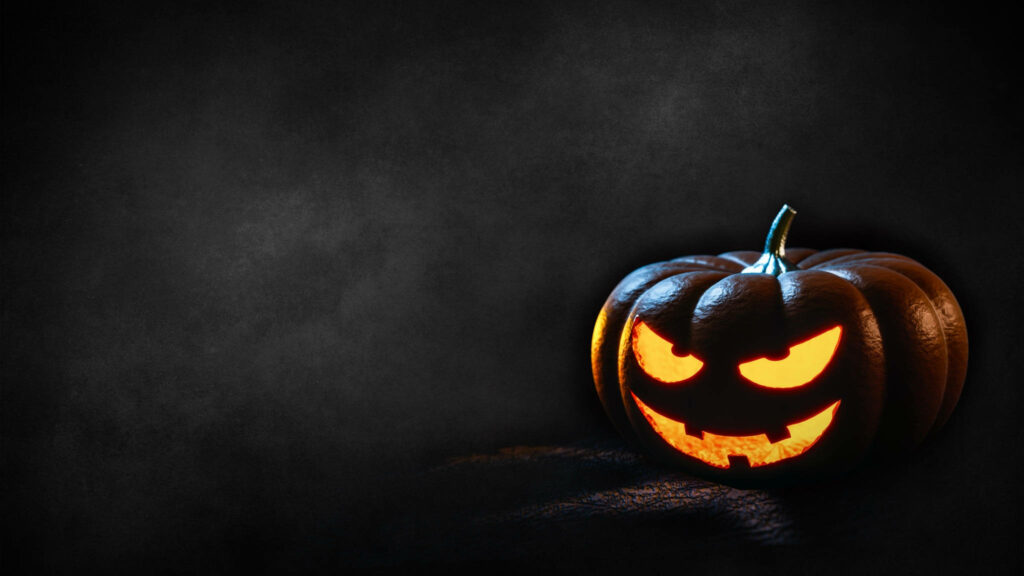 Glowing Jack-o'-Lantern: Spooky Halloween Desktop Delight Wallpaper