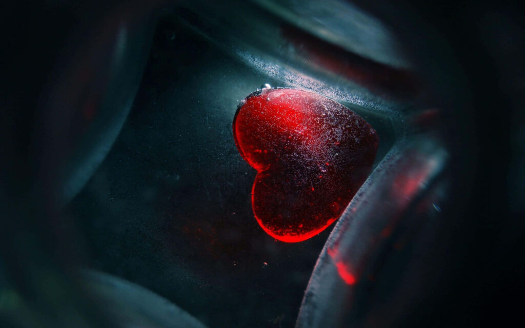 Mystical Red Heart Wallpaper: Love's Warmth Amid Uncertainty