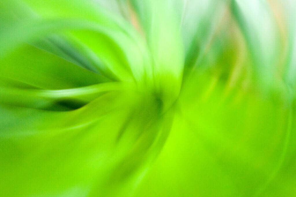 Enchanting Luminescence: A Captivating Light Green Plain Wallpaper