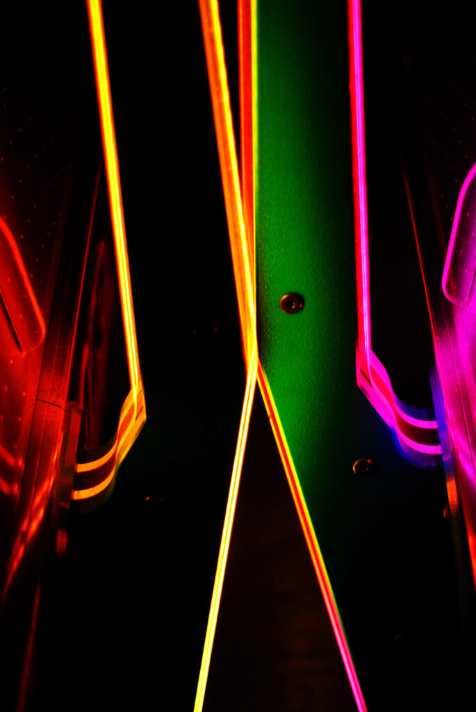 Vibrant Neon Spectrum: Mesmerizing Glows and Textures on Iphone Background Wallpaper