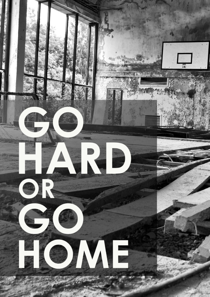 Motivational Quote Wallpaper: 'Go Hard or Go Home' in Abandoned Gym