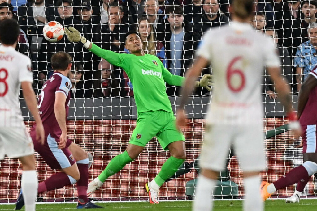 Goalkeeper Alphonse Areola making a dynamic save catching the ball in football match Wallpaper