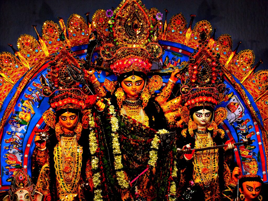 Vibrant Hindu Goddess Durga wallpaper with traditional attire gold red patterns spiritual art