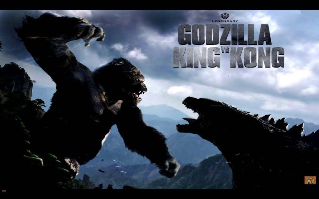 Epic Godzilla versus King Kong wallpaper showing intense Titan battle in rugged mountain landscape