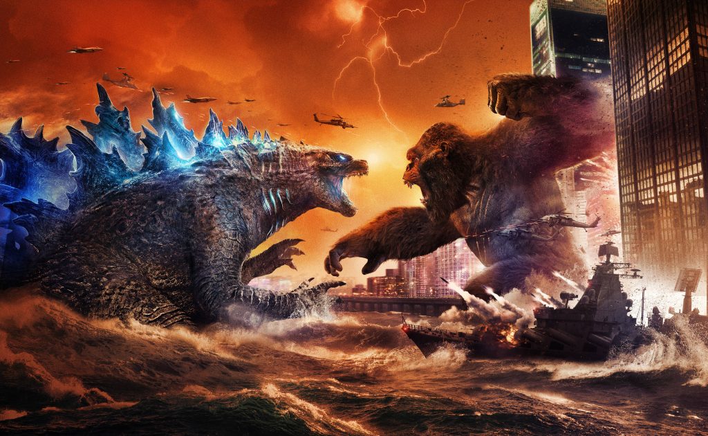 Epic Godzilla vs Kong battle HD wallpaper with glowing Godzilla and fierce Kong city fight