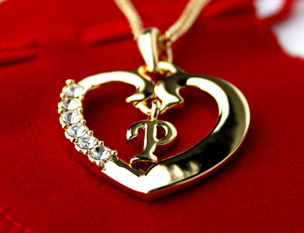 Gold Heart Pendant with Crystals on Rich Red Background – Letter P Wallpaper