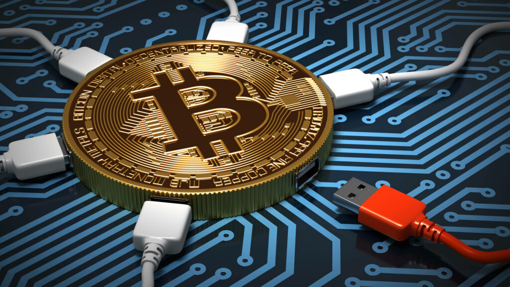 Golden Bitcoin coin connected by USB cables on digital circuit board symbolizing crypto tech Wallpaper