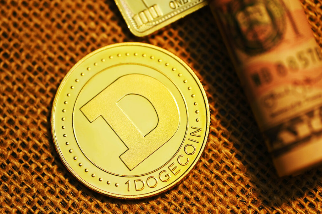 Golden Dogecoin with embossed D and 1 DOGECOIN text on textured background with currency details Wallpaper