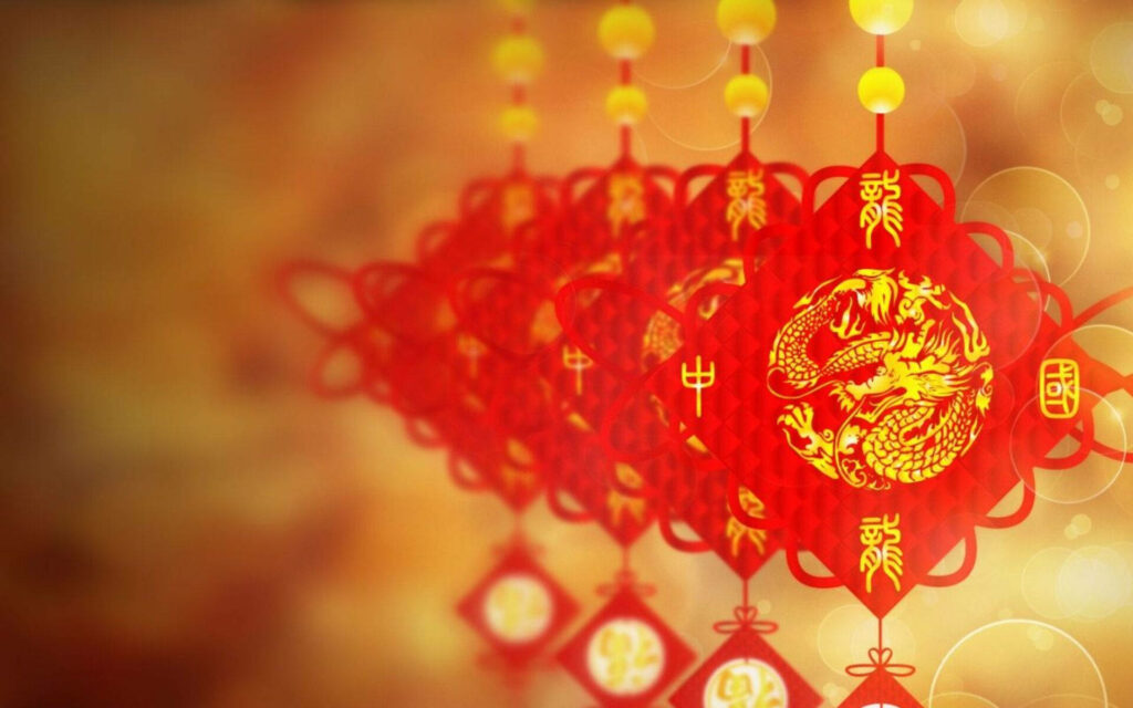 Golden dragon on red Chinese New Year wallpaper with lanterns and festive celebration patterns