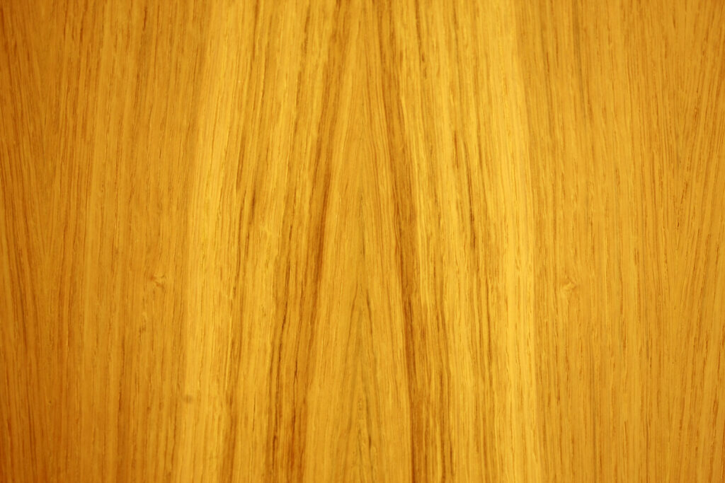 Golden Wooden Canvas: A Captivating Brown to Yellow Textured Background Wallpaper