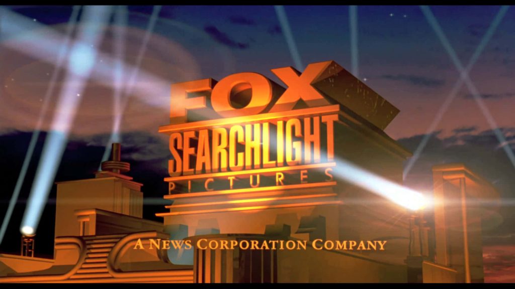 3D Fox Searchlight Pictures logo wallpaper with golden text and searchlights against twilight sky