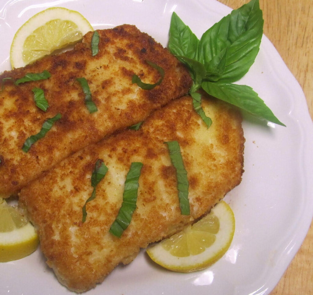 Golden Fried Halibut Fillet Wallpaper with Fresh Basil & Lemon