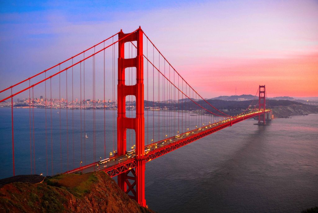 Golden Gate Bridge at sunset vibrant red-orange landmark over San Francisco Bay wallpaper