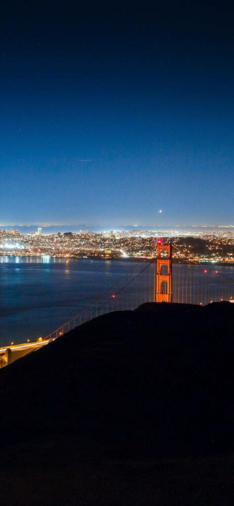 Breathtaking San Francisco Night Skyline with Illuminated Golden Gate Bridge: A Captivating iPhone Wallpaper