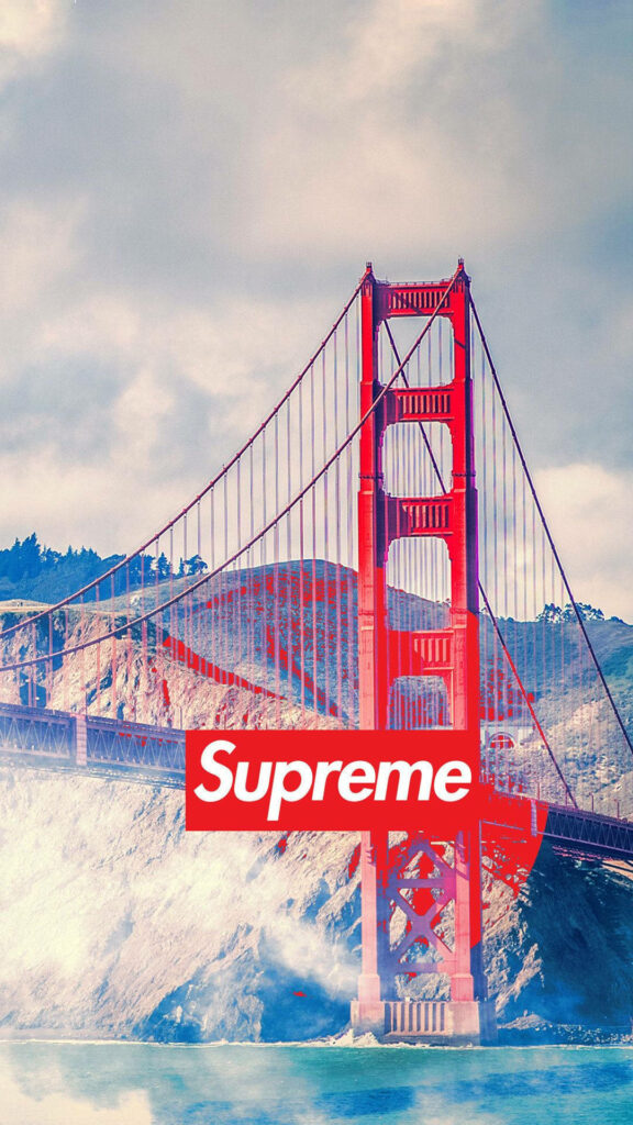 The Iconic Red Supreme Logo Unveiled against the Golden Gate Bridge Scenery - A Mesmerizing Wallpaper Snapshot