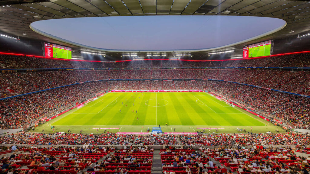 Golden Glow: Embracing the Vibrant Atmosphere at the Soccer Stadium Wallpaper