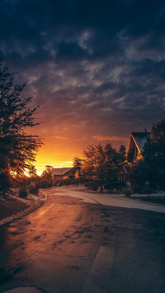Glowing Winter Skies: A Golden Hour Sunset in HD - Perfect Phone Wallpaper Background