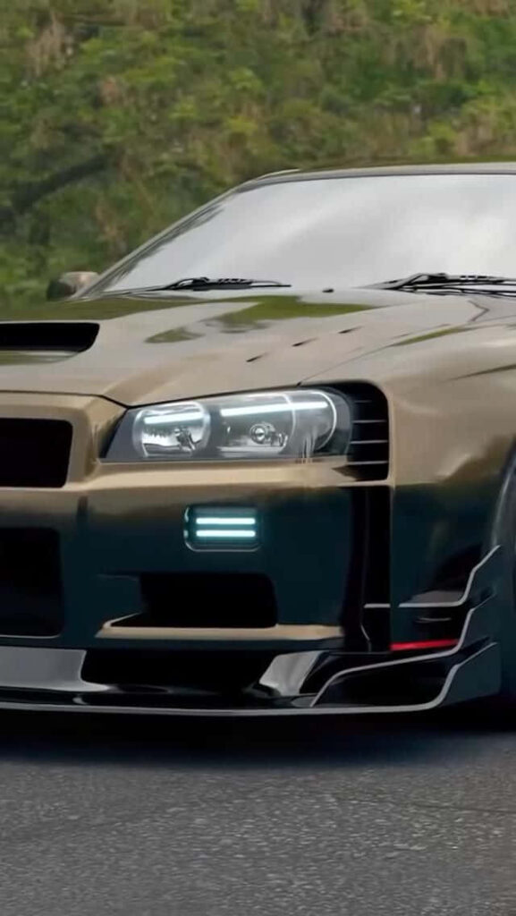 Golden Nissan R35 GTR front view with sleek body in natural blurred background wallpaper