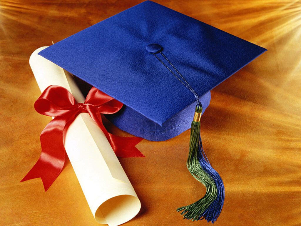 The Captivating Symbolism of Achievement: A Majestically Crafted Blue Cap and Tassel Clasping a Ribbon-tied Diploma, Against a Luxurious Golden-hued Fabric Wallpaper