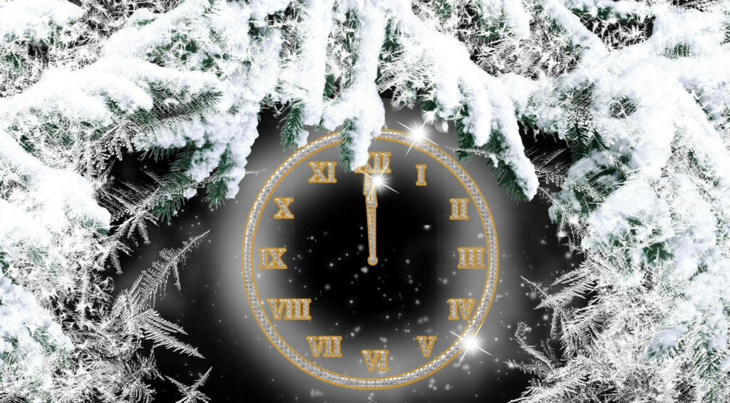 Golden Roman numeral clock glowing at midnight with snowy pine branches and ice crystals winter background Wallpaper